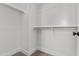 A well-organized walk-in closet with rods and shelving for optimal storage at 9727 E Torino Ave, Mesa, AZ 85212