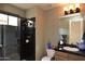 Bathroom featuring a modern shower, stylish vanity, and updated fixtures, offering a comfortable and functional space at 9842 E Celtic Dr, Scottsdale, AZ 85260
