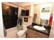 Bathroom boasts a modern design with black tiled shower and updated fixtures at 9842 E Celtic Dr, Scottsdale, AZ 85260