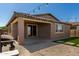 Outdoor space featuring artificial grass, a covered patio with lighting, and a convenient BBQ area at , Avondale, AZ 85323