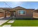 Inviting backyard featuring well-maintained artificial turf and a covered patio area perfect for outdoor relaxation at , Avondale, AZ 85323