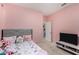Bright bedroom featuring a single bed, TV and neutral carpeting at , Avondale, AZ 85323