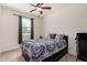 Cozy bedroom features a ceiling fan, a window and neutral wall paint at , Avondale, AZ 85323
