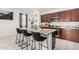 Open kitchen features granite countertops, an island with seating, and stainless steel appliances at , Avondale, AZ 85323