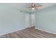 Bedroom with a ceiling fan and wood-look flooring at 10201 N 97Th Ave # B, Peoria, AZ 85345