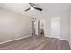 Spacious bedroom featuring wood-look flooring and access to ensuite bathroom, offering convenience and privacy at 10201 N 97Th Ave # B, Peoria, AZ 85345