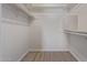 Walk-in closet with wood-look floor and storage space at 10201 N 97Th Ave # B, Peoria, AZ 85345