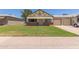 Charming single Gathering home featuring a well-maintained front yard and a two-car garage at 10201 N 97Th Ave # B, Peoria, AZ 85345