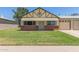 Charming single-Gathering home featuring a well-maintained front yard and a two-car garage at 10201 N 97Th Ave # B, Peoria, AZ 85345