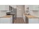 Efficient kitchen design with stainless steel appliances, butcher block countertops, and ample cabinet space at 10201 N 97Th Ave # B, Peoria, AZ 85345