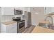 Updated kitchen featuring stainless steel appliances, butcher block countertops, and white subway tile backsplash at 10201 N 97Th Ave # B, Peoria, AZ 85345