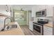 Updated kitchen with stainless steel appliances, wood countertops, and a bright, inviting atmosphere at 10201 N 97Th Ave # B, Peoria, AZ 85345