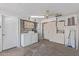 Bright laundry room features washer, dryer, storage cabinets, and convenient access to utility area at 10201 N 97Th Ave # B, Peoria, AZ 85345