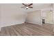 Bright living room showcasing stylish flooring, a ceiling fan, and an open floor plan at 10201 N 97Th Ave # B, Peoria, AZ 85345