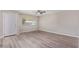 Bright living room showcasing stylish flooring, a ceiling fan, and a door for easy access at 10201 N 97Th Ave # B, Peoria, AZ 85345