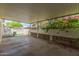 Covered patio with decorative lattice features ample space for seating, dining and outdoor enjoyment at 10201 N 97Th Ave # B, Peoria, AZ 85345