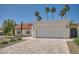 Beautiful home with a large garage, red tile roof and well-maintained landscaping at 10522 E Bella Vista Dr, Scottsdale, AZ 85258