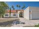 Charming home with red tile roof, landscaped front yard, and inviting entryway at 10522 E Bella Vista Dr, Scottsdale, AZ 85258