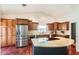 Spacious kitchen featuring stainless steel appliances, granite countertops, and ample cabinet space at 10522 E Bella Vista Dr, Scottsdale, AZ 85258