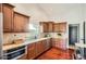 Bright kitchen with ample cabinetry, tile backsplash, stainless steel appliances, and hardwood floors at 10522 E Bella Vista Dr, Scottsdale, AZ 85258
