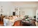 Spacious living room featuring hardwood floors, neutral decor, and ample seating at 10522 E Bella Vista Dr, Scottsdale, AZ 85258