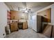 Unfinished basement features a workbench, pegboard, and bonus refrigerator at 10858 E Sahuaro Dr, Scottsdale, AZ 85259