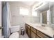 Bathroom features a marble topped vanity and shower/tub combo behind a shower curtain at 10858 E Sahuaro Dr, Scottsdale, AZ 85259