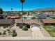 Aerial view of a single-story home with desert landscaping and a basketball hoop on the driveway at 10858 E Sahuaro Dr, Scottsdale, AZ 85259
