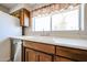 This kitchen features a sink and stainless steel dishwasher beneath a large window at 10858 E Sahuaro Dr, Scottsdale, AZ 85259
