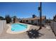Backyard pool with desert landscaping, and nearby covered patio at 10858 E Sahuaro Dr, Scottsdale, AZ 85259