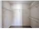 Walk-in closet with carpet flooring and white metal shelving, ready for customizable storage solutions at 10858 E Sahuaro Dr, Scottsdale, AZ 85259