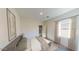 Well-lit bedroom with neutral decor, carpeted floors, large window, and a closet at 13179 E Verbina Ln, Florence, AZ 85132