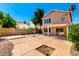 A backyard with a large patio area and block fence at 1334 E Helena Dr, Phoenix, AZ 85022