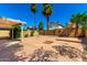 Spacious backyard with patio and mature trees at 1334 E Helena Dr, Phoenix, AZ 85022