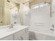 Clean bathroom featuring a white shower-tub combo, updated fixtures and vanity at 1334 E Helena Dr, Phoenix, AZ 85022