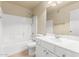 Bright bathroom featuring white cabinets, sink, toilet, and shower-tub combo at 1334 E Helena Dr, Phoenix, AZ 85022