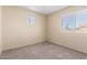 Bedroom featuring carpet flooring, light walls and bright windows at 1334 E Helena Dr, Phoenix, AZ 85022