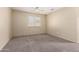 Bedroom with neutral paint and carpet has a window with blinds and ceiling fan at 1334 E Helena Dr, Phoenix, AZ 85022