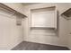 Walk-in closet with carpet and shelving perfect for storage at 1334 E Helena Dr, Phoenix, AZ 85022