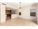 A dining room featuring tile floor and large windows providing plenty of natural light at 1334 E Helena Dr, Phoenix, AZ 85022
