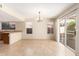 A dining room with tile floor, large windows, and access to the backyard at 1334 E Helena Dr, Phoenix, AZ 85022