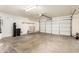 Spacious garage with shelving and plenty of room for parking and storage at 1334 E Helena Dr, Phoenix, AZ 85022