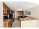 Traditional kitchen featuring granite countertops, tile backsplash, and stainless steel appliances at 1334 E Helena Dr, Phoenix, AZ 85022
