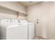 Laundry room featuring a new washer and dryer with shelving at 1334 E Helena Dr, Phoenix, AZ 85022