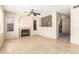 Bright living room featuring tile floor, fireplace, neutral walls, and plenty of natural light at 1334 E Helena Dr, Phoenix, AZ 85022