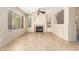 Bright living room featuring tile floor, fireplace, neutral walls, and plenty of natural light at 1334 E Helena Dr, Phoenix, AZ 85022
