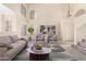 Bright living room featuring vaulted ceilings, neutral walls, and plush carpet, virtually staged with modern decor at 1334 E Helena Dr, Phoenix, AZ 85022