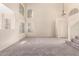 Bright living room featuring vaulted ceilings, neutral walls and plush carpet perfect for cozy nights in at 1334 E Helena Dr, Phoenix, AZ 85022