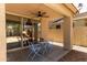 Covered patio seating area with ceiling fan, perfect for outdoor dining and relaxation at 13420 W Berridge Ln, Litchfield Park, AZ 85340