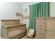 Charming Bedroom with a crib, dresser, and coordinated decor for a cozy space at 14344 W Hackamore Dr, Surprise, AZ 85387